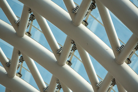 Close-up of a modern architectural structure with intersecting beams.の写真素材