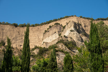 The caves carved by monks in Shio-Mgvime Monastery, medieval monastic complex of Georgian Orthodox Church near the town of Mtskheta in Georgia on 31 August 2025の写真素材