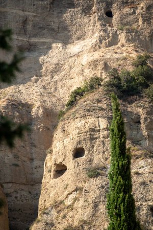 The caves carved by monks in Shio-Mgvime Monastery, medieval monastic complex of Georgian Orthodox Church near the town of Mtskheta in Georgia on 31 August 2025の写真素材