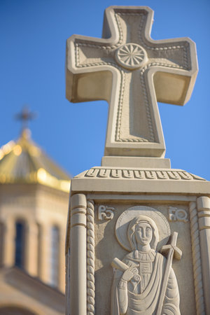 Religious cross in front of Holy Trinity Cathedral of Tbilisi (Sameba), main cathedral of the Georgian Orthodox Church located in Tbilisi, the capital of Georgia on 6 November 2025の写真素材
