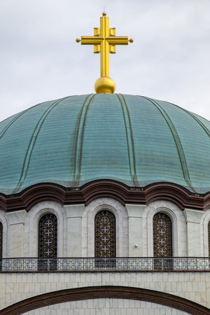 Dome of Saint Sava church with huge golden cross, one of the biggest Orthodox Christian churches in the world in Belgrade, capital of Serbiaの写真素材