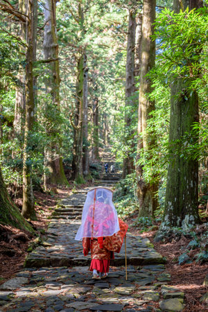 Japanese woman wearing traditional Heian Period costume at the Kumano Kodo Pilgrimage Route, UNESCO World Heritage site in Wakayama prefecture of Japanの写真素材
