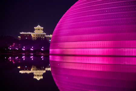 National Centre for the Performing Arts NCPA reflecting in the water at night in Beijing, China on 20 April 2024の写真素材