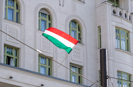 A hungarian flag waving from a building in Budapest, Hungaryの写真素材
