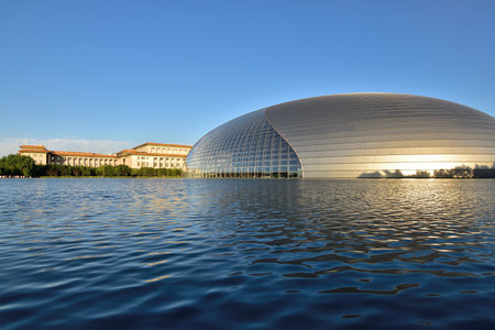 National Centre for the Performing Arts NCPA reflecting in the water in Beijing, China on 12 July 2016の写真素材