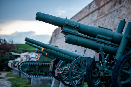Row of historic artillery cannons displayed outdoors, Military museum in Belgrade, Serbia on 15...