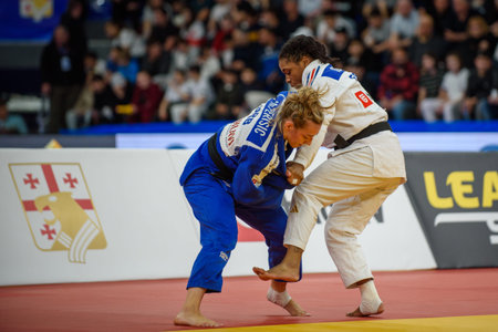 Tbilisi, Georgia. 17 April, 2026. Sarah Leonie CYSIQUE of France (white) against Marica PERISIC of Serbia (blue) in a bronze medal match for Women under 57 kg at European Judo Championships Seniors Tbilisi 2026 Individuals.