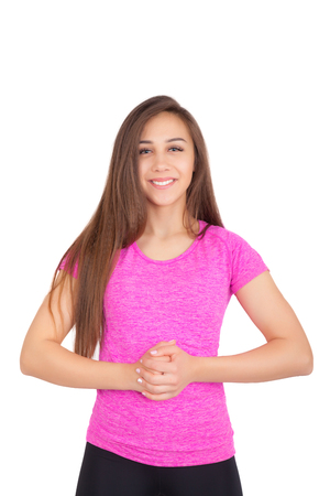 Portrait of a beautiful young woman looking at the camera and smiling, isolated on a white backgroundの写真素材