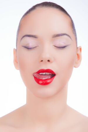 Face of a young girl with red lipsの写真素材