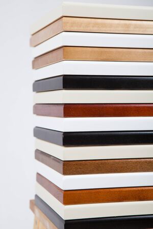 a stack of wooden boards of different colors. verticallyの写真素材
