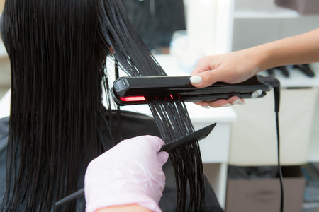 Keratin recovery hair and protein treatment pile with professional ultrasonic iron tool. Concept...