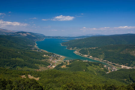 Landscape with lake and a blue dramatic skyの写真素材