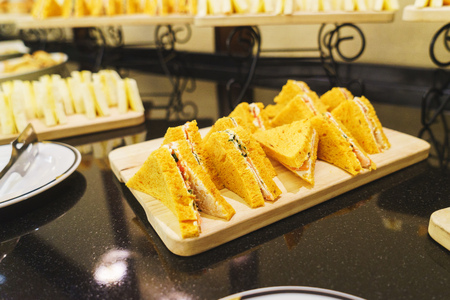 Catering for the event visitors. Table with clean dishes and snacks for a quick guest supply.の写真素材