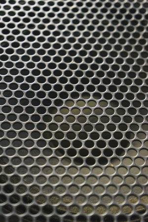 Modern acoustic systems. Metal grating on the sound dynamics. Abstraction and background. Soft focus and beautiful light.の写真素材
