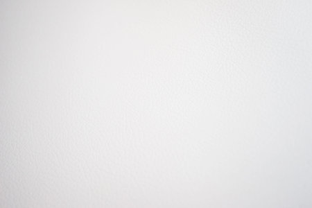 White leather and details of seams close-up. Things made of leather, texture and details of the product. Macro shooting texture and seams leather bag. Soft focus, beautiful bokeh.の写真素材