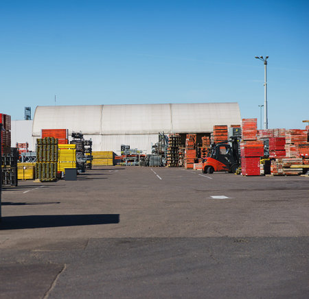 Modern electric forklift carries special metal structures for the construction and erection works....