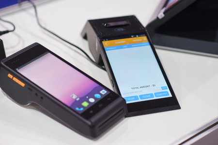 modern wireless terminal for payment with a touch screen. customer service in a sales outlet using...