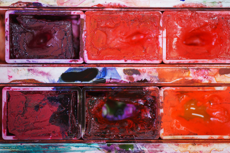 Extremely close-up watercolor paint. Wallpapers and an abstract background - a concept for an art school or an artist. Soft focus, beautiful bokeh and little depth of field. Brushes and watercolors.の写真素材