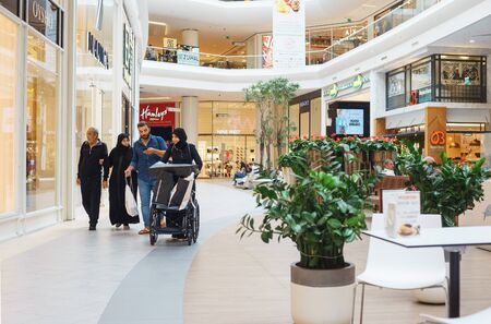 September 2018, Istanbul, Turkey. Bright premise of a modern shopping center with shops and visitors. Interiors, scenery and advertising signs in the shopping center. Visitors to the shopping center.のeditorial素材