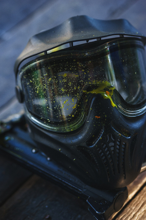 Special protective mask for playing paintball with traces and spot of hit of a ball with paint.の写真素材