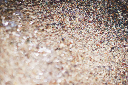Travel, beach vacation concept. Abstract backgrand pebbles texture on the beach. Rest and travel to the sea concept. Summer vacation. Soft focus, toning.の写真素材