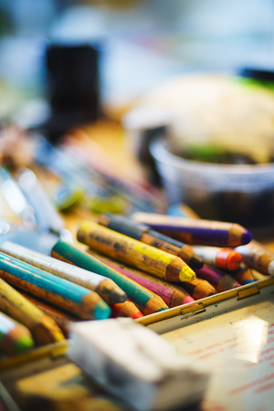 Workplace artist close-up. Wooden base for canvas or paper, stretcher. Soft focus and beautiful bokeh. Concept for art school or artist.の写真素材
