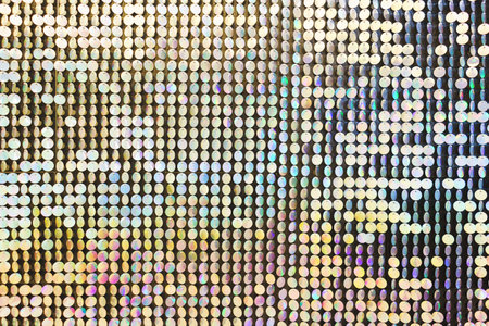 Bright, festive, sparkling, dazzling, abstract background. Festive decorations and decoration of round shiny metallic sequins. Soft blur and small depth of field.の写真素材