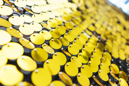 Bright, festive, sparkling, dazzling, abstract background. Festive decorations and decoration of round shiny metallic sequins. Soft blur and small depth of field.の写真素材