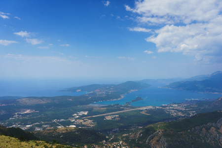 Spectacular view of the Bay of Kotor in Montenegro. View of the bay and city Tivat and airport from the top of the mountain. Stunning landscape. Travel to Montenegro.の写真素材