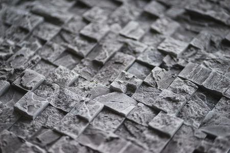 Decorative surface of a wall trimmed by an imitation of a stone and a brick. Repair and finishing. Abstract background texture.の写真素材