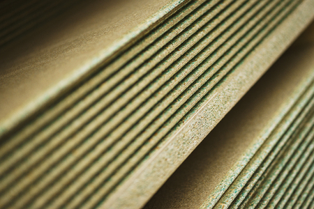 Several sheets of new clean, waterproof plywood in a stack. Sale of goods for repair and decoration. Wood and texture. Abstract background and shallow depth of field.の写真素材