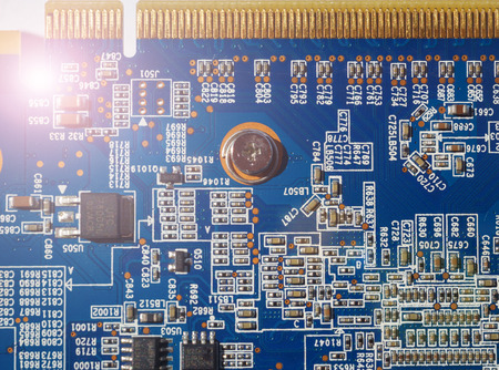 Close-up electronic circuit board with condensers and connectors for connecting peripherals and external devices. Motherboard for personal computer, laptop or workstation. Macro. Soft focus.の写真素材