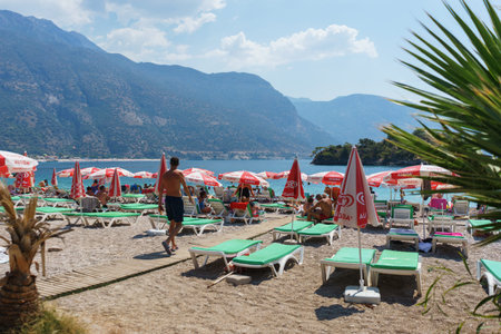 TURKEY, OLUDENIZ - August, 2019. Beach holidays on the beach. Panorama of the beach Blue Lagoon....