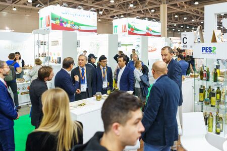 MOSCOW, RUSSIA-September, 2019. International exhibition at the Expocenter. Visitors, exhibitors and stands during work. Marketing, business and communications of manufacturers and customers.のeditorial素材