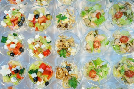 Catering and guest meals during the event. Quick mini snacks in a special beautiful dish. Canapes and light meals, tapas on the table in the restaurant.の写真素材