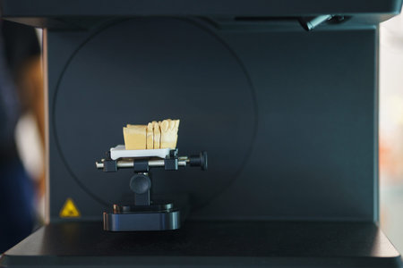 Cad cam machine in dental laboratory. Production of dental crowns and dentures. Milling dental...