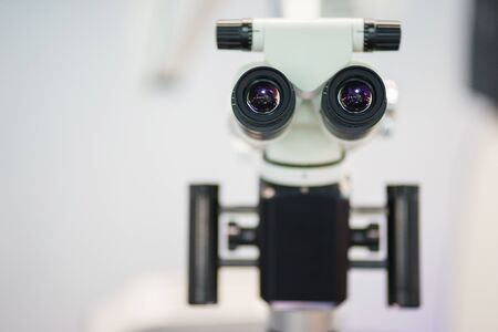 Professional dental endodontic binocular microscope. Equipment and modern technology for the dental clinic. Dental treatment and prosthetics, installation of dentures.の写真素材