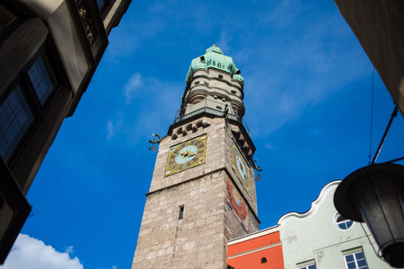 INSBRUK, AUSTRIA - FEBRUARY 2020:Pedestrians, residents and tourists in the narrow streets of the...