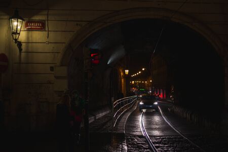 PRAGUE, CZECH REPUBLIC - OCTOBER 2019. Residents, guests of the city on Night streets walking to see the sights. Travel old European city. Autumn season. Night photography ,high sensitivity.のeditorial素材