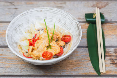 Traditional seafood noodles decorated with pepper and asparagus.の写真素材