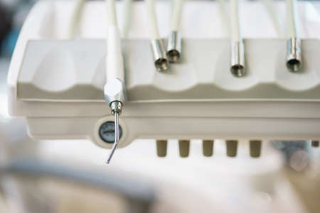 Dental equipment at the clinic close-up. Medical instruments for examining and treating patients.の写真素材