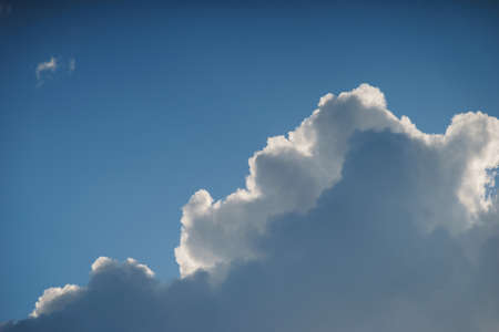 Large white cumulus clouds against a blue sky.の写真素材