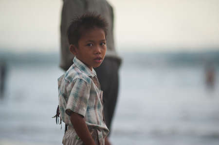 BALI, INDONESIA-MARCH 2020: Indonesian children play on the beach at sunset time. Active, beach holidays in Asian countries. Landscape Bali Thailand. Soft focus. Lots of tourists on the beach.のeditorial素材