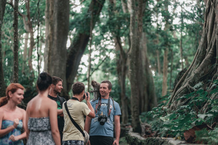 KUTA, INDONESIA-SPRING, 2020: Busy traffic on the island of Bali. Tourists and residents of the...