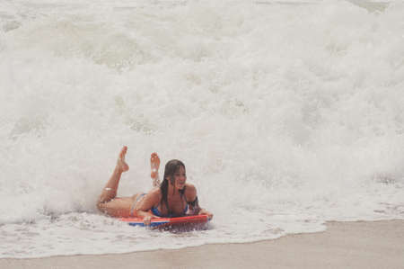 KUTA, INDONESIA - SPRING, 2020: Active vacation on the beach Semenyak, Jimbaran. Beach holidays and entertainment at sea, tourists and residents relax on the beach. Travel to Asia.のeditorial素材