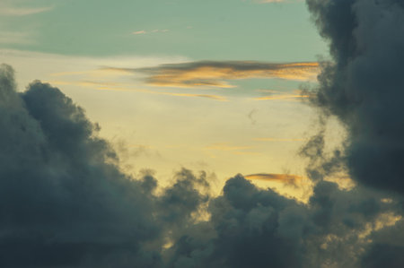 Magical dramatic sunset on a tropical beach. Seascape, ocean waves and bright clouds in the sky....