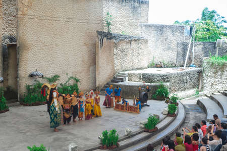 BALI-APRIL, 2020: Garuda Wisnu Kencana Cultural Park on island Bali. Traditional Balinese dance Kechak, dancers tell a story, dancing with eyes, fingers and limbs. Performance on stage.のeditorial素材
