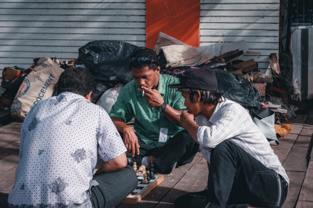 KUTA, BALI, INDONESIA-APRIL, 2020: Indonesians locals and street market employees sell souvenirs,...