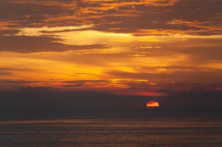 Stunning dramatic sunset over the ocean.の写真素材