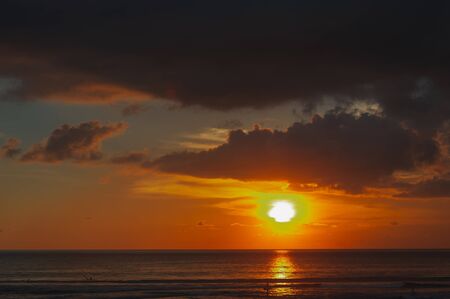 Stunning dramatic sunset over the ocean.の写真素材